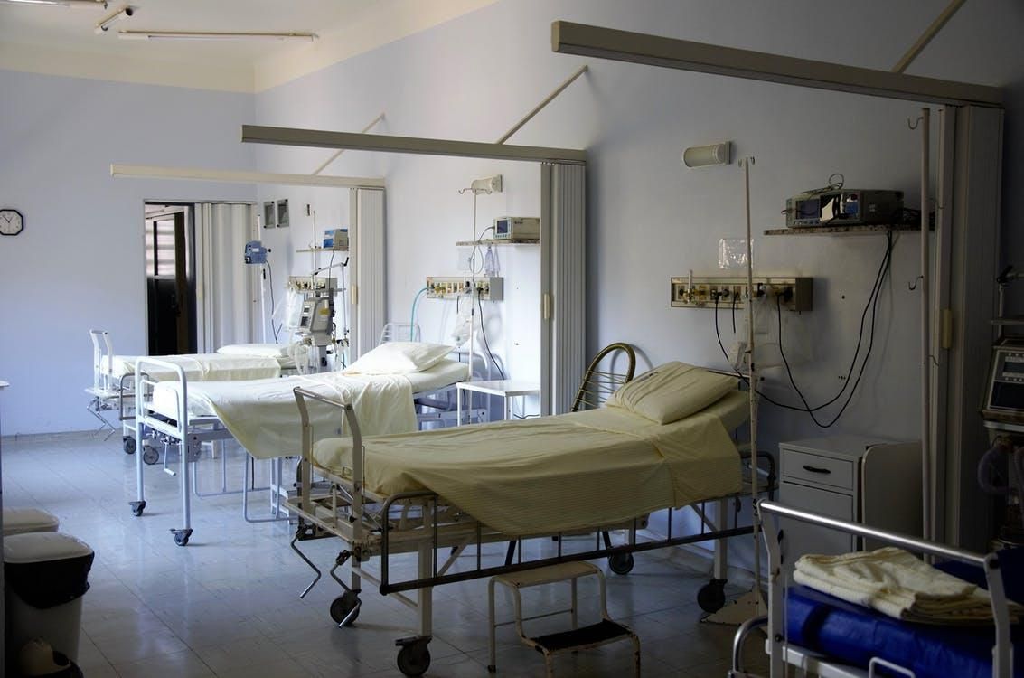 Patient beds with medical equipment in a hospital